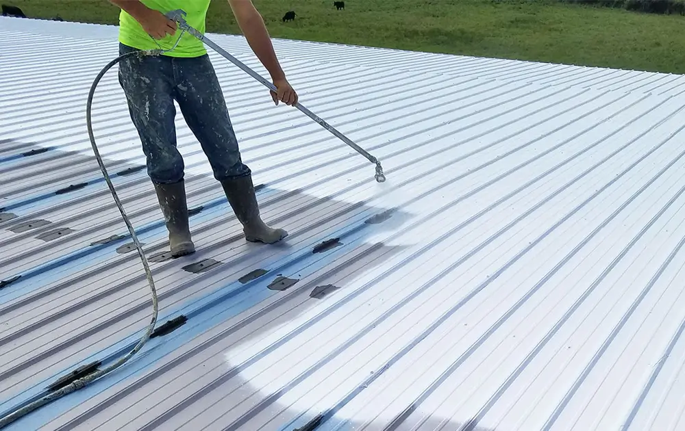 Roof coating being applied