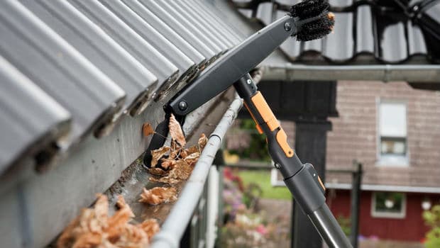Gutter cleaning on a residential roof